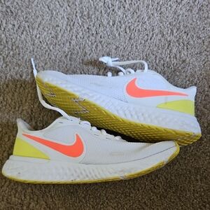 White and Neon Orange Athletic Shoes